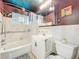 Bathroom featuring tiled walls, shower-tub combo, and updated vanity at 5600 Hobson Ne St, St Petersburg, FL 33703