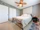 Cozy bedroom with ceiling fan, neutral walls, closet, patterned rug and comfortable bed at 5600 Hobson Ne St, St Petersburg, FL 33703