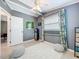 Bedroom featuring a ceiling fan, a window, and stylish decor at 5600 Hobson Ne St, St Petersburg, FL 33703