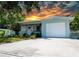 Charming single-story home features a manicured lawn, a garage, and a freshly painted exterior at 5600 Hobson Ne St, St Petersburg, FL 33703