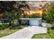 Charming single-story home with well-maintained landscaping, large shade tree, and freshly painted exterior at 5600 Hobson Ne St, St Petersburg, FL 33703