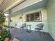 Inviting front porch with chairs, showing the home's facade details and entrance at 5600 Hobson Ne St, St Petersburg, FL 33703