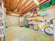 Spacious garage with high ceilings, storage shelves, and a bright yellow bicycle at 5600 Hobson Ne St, St Petersburg, FL 33703