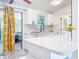Updated kitchen featuring white cabinets, tile backsplash, and quartz countertops at 5600 Hobson Ne St, St Petersburg, FL 33703