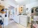 A laundry area with washer, dryer, water heater and access to updated kitchen at 5600 Hobson Ne St, St Petersburg, FL 33703