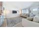 Charming living room features neutral decor and lots of natural light at 5600 Hobson Ne St, St Petersburg, FL 33703