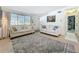 Bright living room featuring neutral furniture, eye-catching rug, and a large window at 5600 Hobson Ne St, St Petersburg, FL 33703