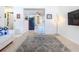 Living room with a view of kitchen, featuring easy access and modern lighting at 5600 Hobson Ne St, St Petersburg, FL 33703