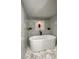 Luxurious bathroom with a sleek, modern tub and stylish tile work, creating a spa-like retreat at 5614 Kenny Dr, Tampa, FL 33617