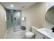 Well-lit bathroom with a glass-enclosed shower, contemporary fixtures, and neutral color scheme at 5614 Kenny Dr, Tampa, FL 33617
