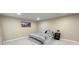 Cozy bedroom featuring a comfortable bed, neutral paint, and recessed lighting for a modern feel at 5614 Kenny Dr, Tampa, FL 33617