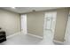 Bedroom features tile flooring, access to a closet, and adjacent doorway to additional rooms at 5614 Kenny Dr, Tampa, FL 33617