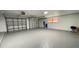Two car garage featuring storage space and epoxy flooring at 5614 Kenny Dr, Tampa, FL 33617