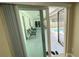 View through sliding glass doors to a covered patio and pool area, perfect for outdoor relaxation and entertainment at 5614 Kenny Dr, Tampa, FL 33617
