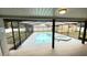 Inviting screened-in pool and hot tub area with a spacious deck, perfect for outdoor relaxation and entertaining at 5614 Kenny Dr, Tampa, FL 33617