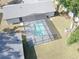 Aerial view of a screened-in pool and fenced yard in a home's backyard at 5614 Kenny Dr, Tampa, FL 33617