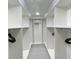 Well-organized walk-in closet with custom shelving and ample space for clothes and accessories at 5614 Kenny Dr, Tampa, FL 33617