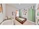 Bright and cheerful bedroom with a toddler bed, decorative wall art, and natural light at 5645 Del Coronado Dr, Apollo Beach, FL 33572