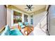 Covered patio featuring ceiling fan, string lights, and seating for relaxing outdoors at 5645 Del Coronado Dr, Apollo Beach, FL 33572
