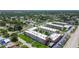 Aerial view featuring condos in a neighborhood setting showcases the nearby mature trees at 5728 14Th N Ave # 101B, St Petersburg, FL 33710
