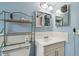 Cozy bathroom featuring neutral fixtures, mirrors, and bright vanity lighting at 5728 14Th N Ave # 101B, St Petersburg, FL 33710