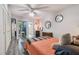 Bright bedroom with a comfortable bed, light color walls, and mirrored closets with view to other rooms at 5728 14Th N Ave # 101B, St Petersburg, FL 33710