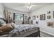 Inviting bedroom featuring a comfortable bed, hardwood floors, and ample natural light from the window at 5728 14Th N Ave # 101B, St Petersburg, FL 33710