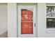 Condo entrance with red door, sidelight, and view of the exterior at 5728 14Th N Ave # 101B, St Petersburg, FL 33710