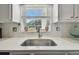 Bright kitchen with a sink that has a beautiful backyard view at 5728 14Th N Ave # 101B, St Petersburg, FL 33710