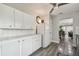 Bright kitchen with white cabinets, appliances and a breakfast nook at 5728 14Th N Ave # 101B, St Petersburg, FL 33710