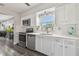 Well-lit kitchen with stainless steel appliances and quartz countertops at 5728 14Th N Ave # 101B, St Petersburg, FL 33710