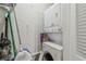 Efficient laundry area with stacked washer and dryer, showcasing its functional design and space-saving features at 5728 14Th N Ave # 101B, St Petersburg, FL 33710