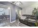Comfortable living room with sleek flooring and a power reclining sofa with view of other rooms through mirrors at 5728 14Th N Ave # 101B, St Petersburg, FL 33710