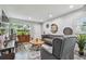 Bright living room with hardwood floors, modern decor, and bright window at 5728 14Th N Ave # 101B, St Petersburg, FL 33710