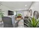 Charming living room with hardwood floors, modern decor, and entertainment center at 5728 14Th N Ave # 101B, St Petersburg, FL 33710