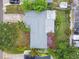 Aerial view of house showcasing new roof and vibrant backyard oasis at 5961 36Th Ave N, St Petersburg, FL 33710