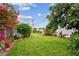 Spacious backyard with lush green grass and meticulously maintained landscaping at 5961 36Th Ave N, St Petersburg, FL 33710
