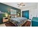 Comfortable bedroom features a tropical floral theme, accent wall, and double door closet at 5961 36Th Ave N, St Petersburg, FL 33710