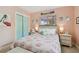 Charming bedroom features a plush bed, dual windows, and ample natural light at 5961 36Th Ave N, St Petersburg, FL 33710