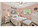 Charming bedroom features a plush bed, dual windows, and ample natural light at 5961 36Th Ave N, St Petersburg, FL 33710