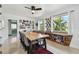 Bright dining room featuring a large wooden table with seating for eight and natural lighting at 5961 36Th Ave N, St Petersburg, FL 33710