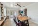 Dining room featuring a wooden table with seating for six, a bookshelf, and access to the patio at 5961 36Th Ave N, St Petersburg, FL 33710