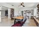 Bright dining room area showcasing a large wooden table, chairs, and unique shelving at 5961 36Th Ave N, St Petersburg, FL 33710