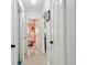 Hallway view with multiple doorways leading to various rooms with neutral colored walls and flooring at 5961 36Th Ave N, St Petersburg, FL 33710
