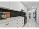Contemporary kitchen featuring white cabinetry, stone countertops, and stainless steel appliances at 5961 36Th Ave N, St Petersburg, FL 33710