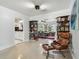 Open-concept living area showcasing decorative bookshelves, comfortable seating, and abundant natural light at 5961 36Th Ave N, St Petersburg, FL 33710