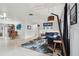 Spacious living room boasts a modern rug, contemporary furniture, and large windows for ample natural light at 5961 36Th Ave N, St Petersburg, FL 33710