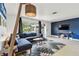 Stylish living room featuring contemporary furnishings, a vibrant rug, and a large window offering a bright, airy feel at 5961 36Th Ave N, St Petersburg, FL 33710