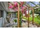 Relaxing outdoor seating area under a pergola with a lush garden view at 5961 36Th Ave N, St Petersburg, FL 33710