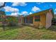 Cozy backyard featuring a screened-in porch and space for outdoor relaxation at 6121 Piedmont Dr, Spring Hill, FL 34606